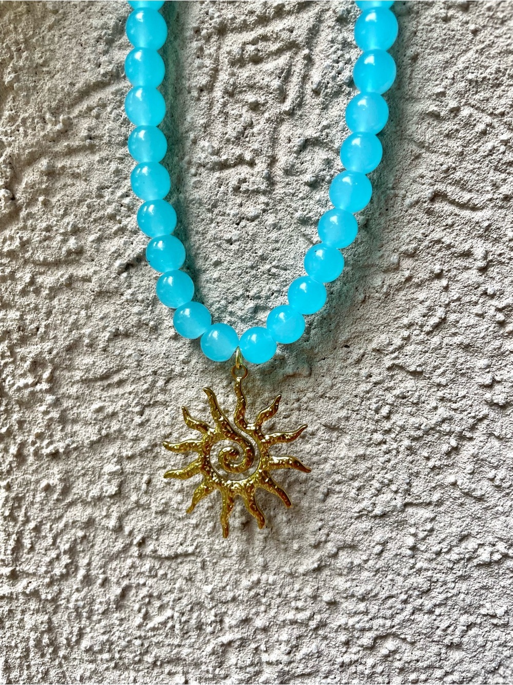 Marshalls Aqua Beaded Necklace with Gold Sun Pendant never worn